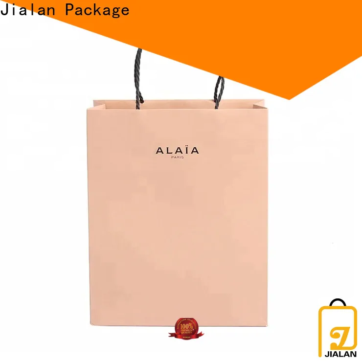 Buy custom brown paper bags with handles manufacturer for goods packaging