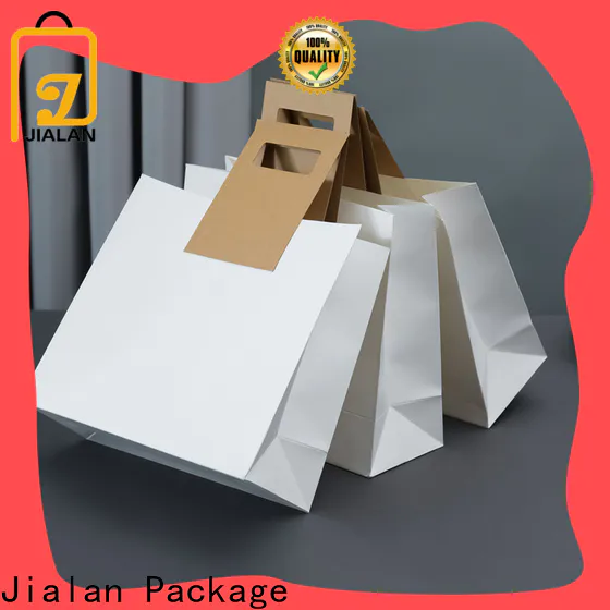 Bulk kraft paper carry bags supplier for shopping in supermarkets