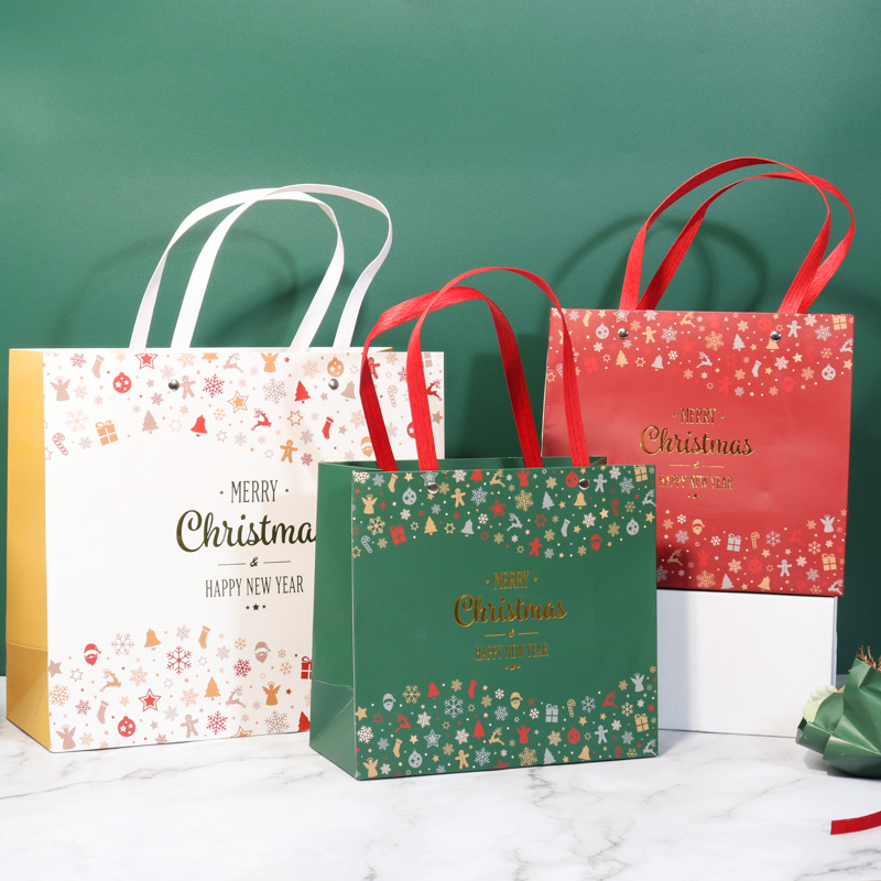 Bolsas de regalo de papel de Navidad al por mayor de fábrica con asa